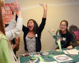girls cheer when their experiment succeeds at Science Rendezvous event