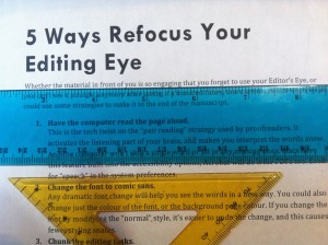 photo of printed text viewed through a blue ruler and a yellow ruler