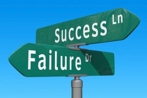 failure + success crossroads signs